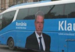 Klaus Iohannis cară oamenii cu autocarul la miting