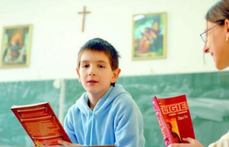 Legea prin care înscrierea elevilor la orele de religie se face pe bază de cerere, promulgată