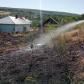 Gospodărie pusă în pericol de un incendiu de vegetație uscată - FOTO