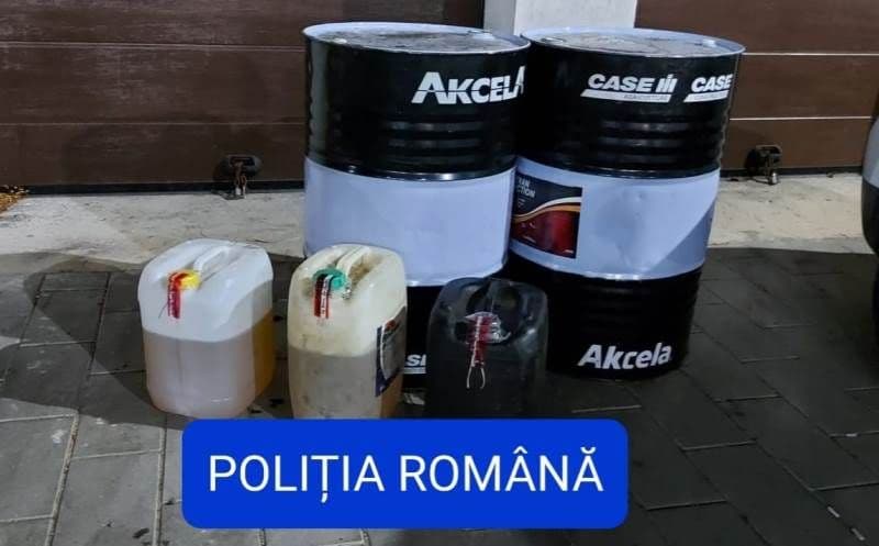Percheziții la trei locuințe din județ. Polițiștii au descoperit 1.260 de litri de motorină furată - FOTO