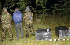 Contrabandişti surprinşi cu ţigările în spate pe malul râului Prut - FOTO