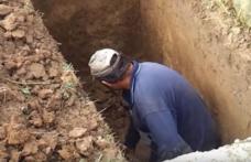 Caz uluitor în Iași: Un gropar a murit la sfârşitul unei slujbe de înmormântare, când astupa groapa altuia