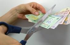 Au venit primele tăieri de salarii, în ajun de Sărbători