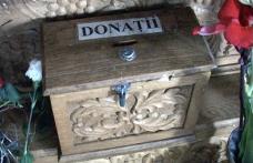 Un bărbat și-a făcut cruce înainte de a fura banii din cutia milei dintr-o biserică