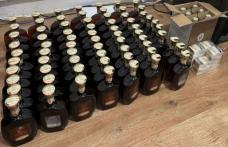 70 de sticle de coniac și mai multe pachete cu țigări confiscate în urma unui control al polițiștilor de frontieră