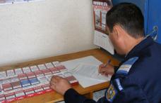 Peste 200 de pachete de ţigări de contrabandă descoperite de jandarmi asupra unei femei