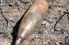 Obuz exploziv descoperit într-o livadă din Curteşti