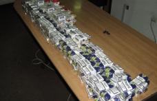 Ţigări de contrabandă trecute peste râul Prut cu ajutorul unei sfori, confiscate de polițiștii de frontieră