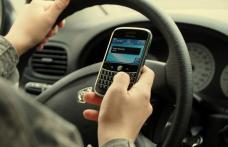 1000 de euro amendă şi închisoare pentru folosirea telefonului la volan