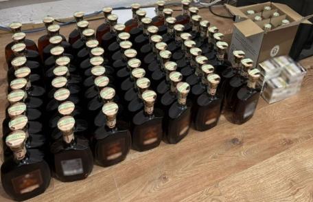 70 de sticle de coniac și mai multe pachete cu țigări confiscate în urma unui control al polițiștilor de frontieră