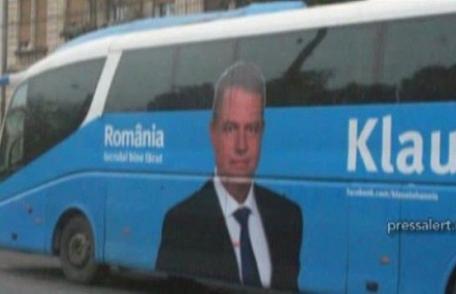 Klaus Iohannis cară oamenii cu autocarul la miting