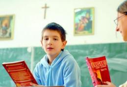 Legea prin care înscrierea elevilor la orele de religie se face pe bază de cerere, promulgată