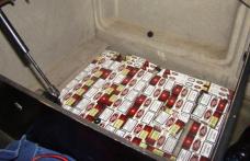 Ţigări de contrabandă ascunse în spatele scaunului şoferului unui autocamion