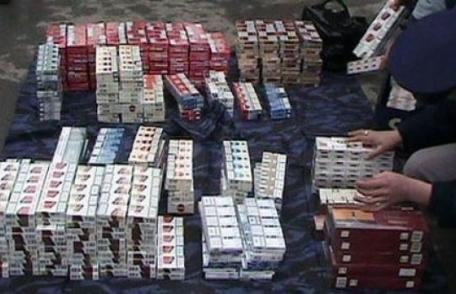 Percheziții domiciliare la persoane bănuite de contrabandă cu țigări 