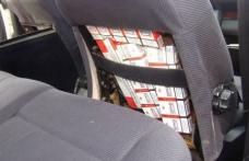 Ţigări ascunse între scaunele unui autovehicul